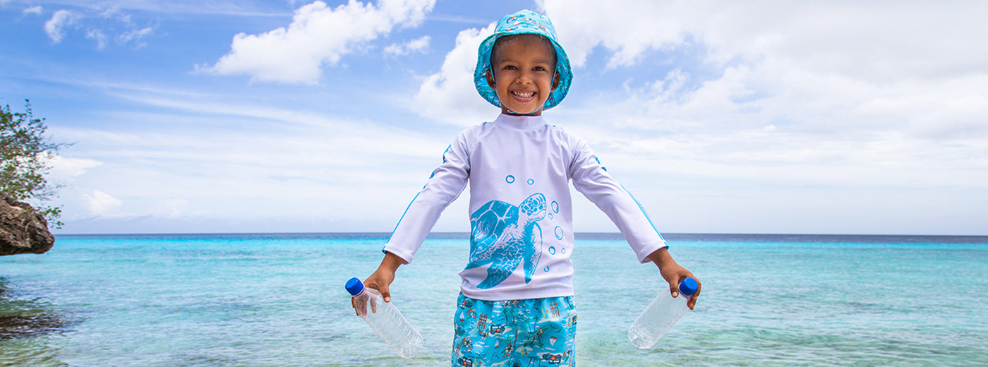 Flap Happy Kona Bay UPF 50+ Hat and Trunks with Sublimated Salty Turtle Graphic Long sleeve rashguard for Boys ages 6m thru 7. All made with repreve fibers made from recycled plastic bottles.